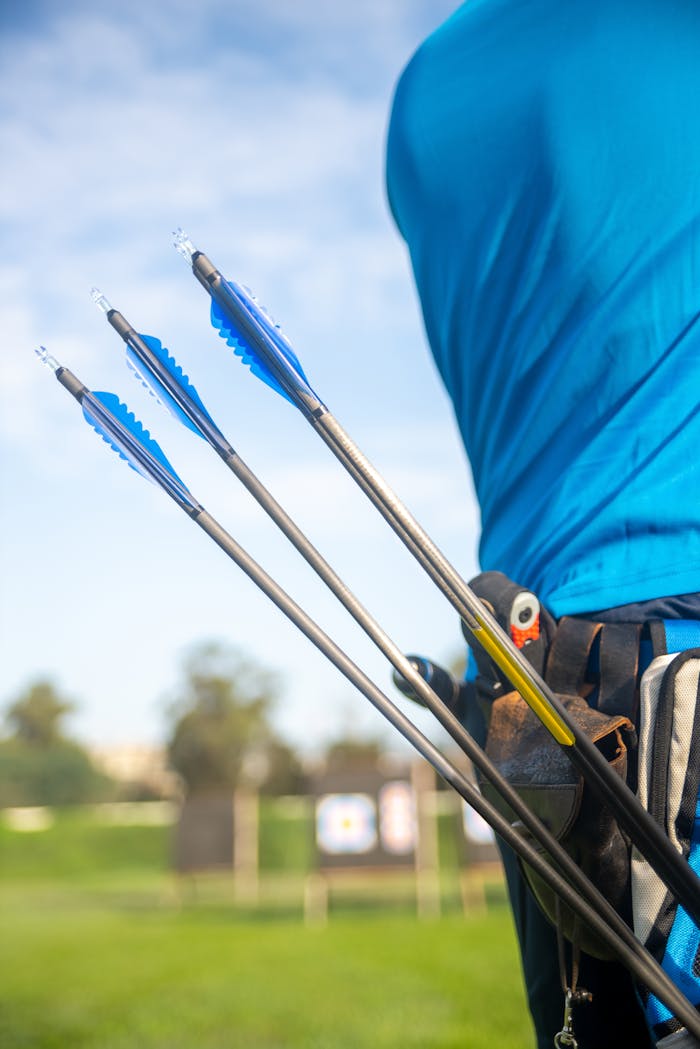 Close-up Photo of Blue Archery Arrows