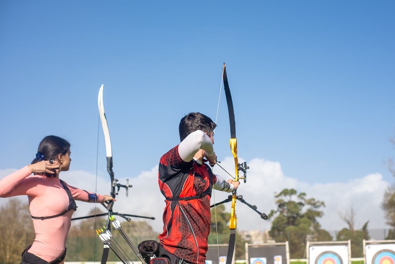 Archers aiming archery Bows and Arrows